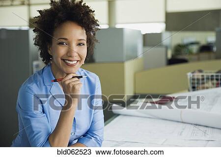 African architect working on blueprints in office View Large Photo Image Stock Image - African architect working on blueprints in office. Fotosearch
