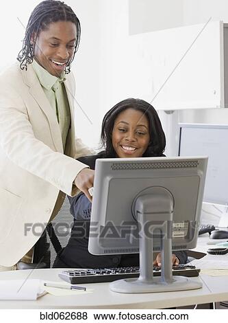 Stock Photo - African business people working on computer. Fotosearch