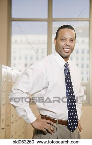 African businessman in file room View Large Photo Image Stock Image - African businessman in file room. Fotosearch