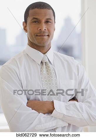 Stock Photo - African businessman looking confident. Fotosearch