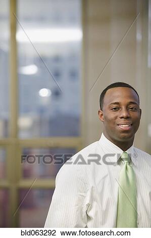 African businessman posing in office View Large Photo Image Stock Image - African businessman posing in office. Fotosearch