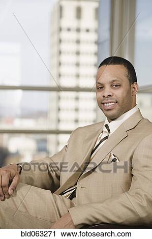 African businessman smiling View Large Photo Image Stock Image - African businessman smiling. Fotosearch