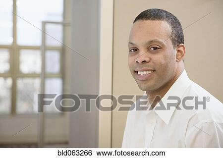 African businessman smiling View Large Photo Image Stock Photograph - African businessman smiling. Fotosearch