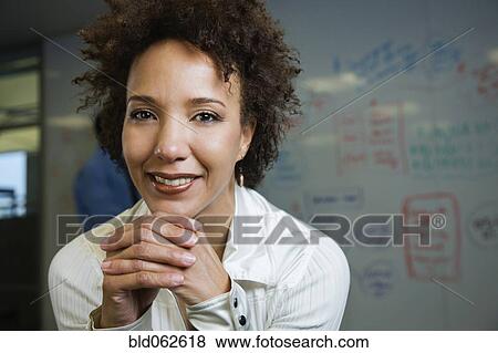 Stock Photo - African businesswoman in front of whiteboard. Fotosearch