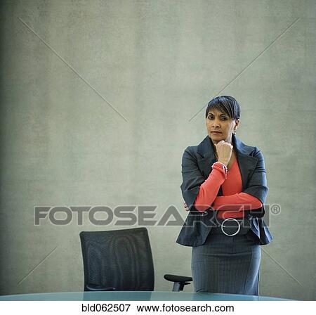 Stock Photo - African businesswoman looking serious in office. Fotosearch