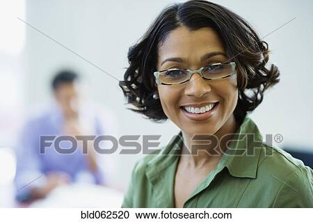 African businesswoman with eyeglasses smiling View Large Photo Image Stock Image - African businesswoman with eyeglasses smiling. Fotosearch