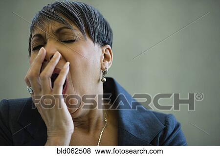 Stock Photo - African businesswoman yawning. Fotosearch