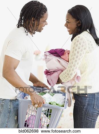African couple doing laundry View Large Photo Image Stock Photo - African couple doing laundry. Fotosearch