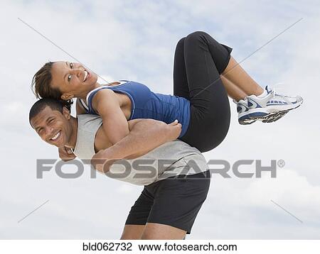 Stock Image - African couple in athletic clothing. Fotosearch