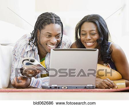 African couple shopping online View Large Photo Image Stock Photograph - African couple shopping online. Fotosearch