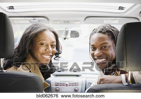 African couple sitting in car View Large Photo Image Stock Photograph - African couple sitting in car. Fotosearch