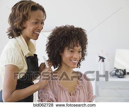 African hairdresser and client View Large Photo Image Stock Photo - African hairdresser and client. Fotosearch