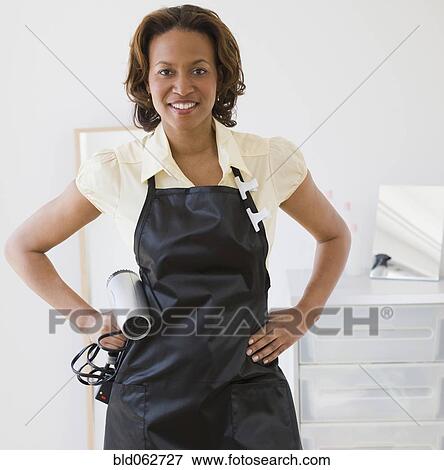 African Hairdresser Holding Hair Dryer Stock Photo Bld062727