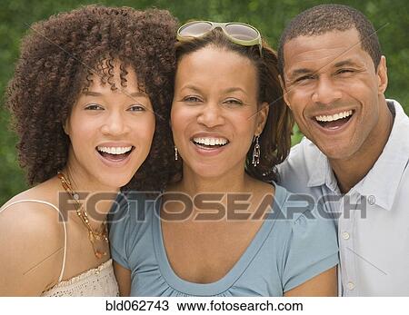 Stock Image - African man and women smiling. Fotosearch