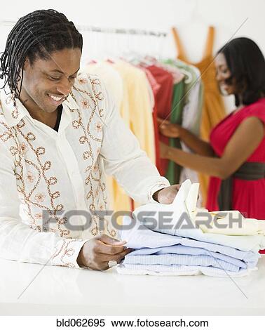 Stock Photography - African man shopping. Fotosearch