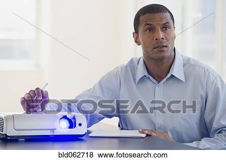 African man working slide projector View Large Photo Image Stock Photo - African man working slide projector. Fotosearch