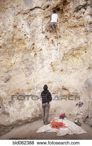 Argentinean men rock climbing together View Large Photo Image Stock Photo - Argentinean men rock climbing together. Fotosearch
