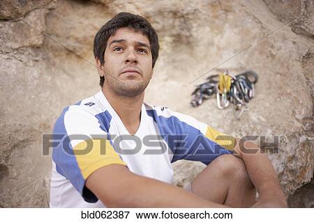 Argentinean rock climber looking pensive View Large Photo Image Stock Photo - Argentinean rock climber looking pensive. Fotosearch