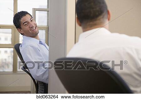 Businessmen exchanging gossip View Large Photo Image Picture - Businessmen exchanging gossip. Fotosearch