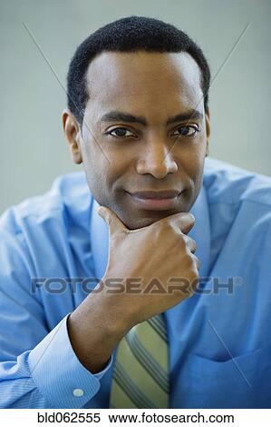 Stock Photography - Close up of African businessman looking confident. Fotosearch