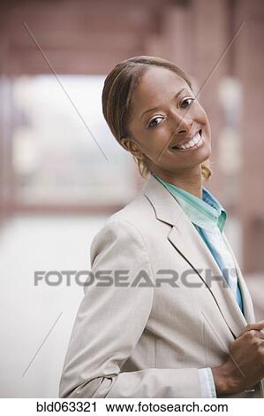 Close up of African businesswoman smiling View Large Photo Image Stock Image - Close up of African businesswoman smiling. Fotosearch