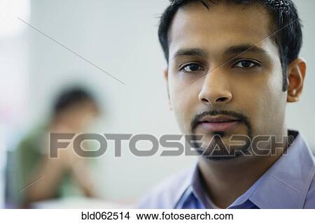 Close up of Indian businessman looking serious View Large Photo Image Picture - Close up of Indian businessman looking serious. Fotosearch