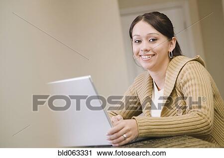 Hispanic woman using laptop View Large Photo Image Stock Image - Hispanic woman using laptop. Fotosearch