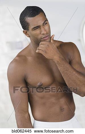 Stock Photography - Indian man looking pensive. Fotosearch