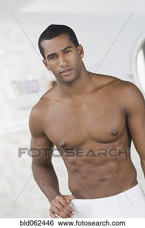 Stock Photograph - Indian man wrapped in towel. Fotosearch