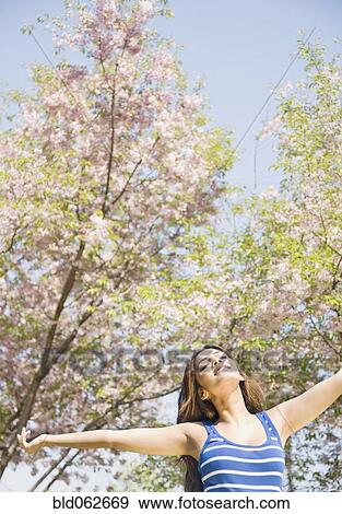 Stock Photo - Middle Eastern woman enjoying nature. Fotosearch