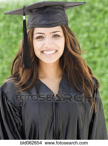 Picture - Middle Eastern woman in cap and gown. Fotosearch