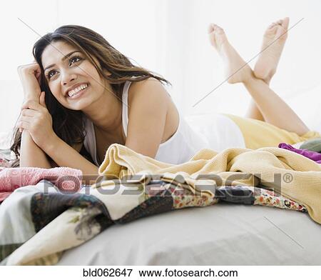 Middle Eastern woman laying in bed View Large Photo Image Stock Photo - Middle Eastern woman laying in bed. Fotosearch