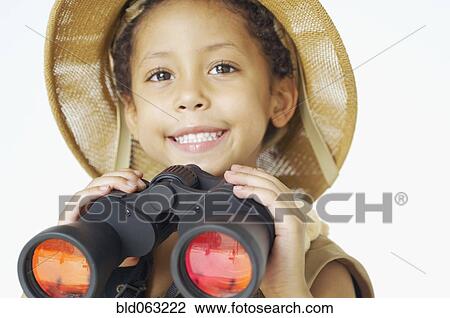 Mixed race boy in safari hat holding binoculars View Large Photo Image Stock Image - Mixed race boy in safari hat holding binoculars. Fotosearch