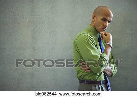 Mixed race businessman looking pensive View Large Photo Image Picture - Mixed race businessman looking pensive. Fotosearch