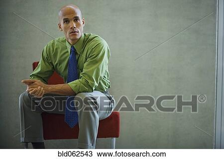 Mixed race businessman looking serious View Large Photo Image Stock Image - Mixed race businessman looking serious. Fotosearch