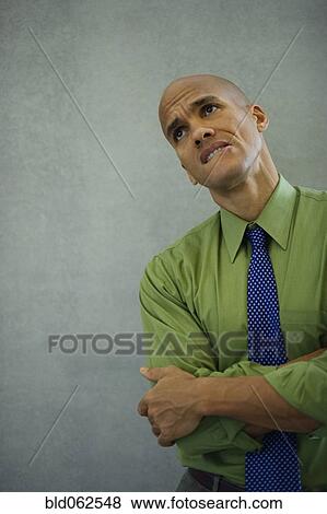 Mixed race businessman looking worried View Large Photo Image Stock Photo - Mixed race businessman looking worried. Fotosearch