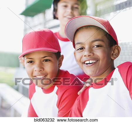 Multi-ethnic boys in baseball uniforms smiling View Large Photo Image Stock Image - Multi-ethnic boys in baseball uniforms smiling. Fotosearch