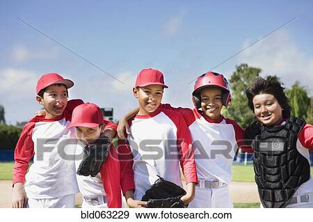 Stock Photo - Multi-ethnic boys in baseball uniforms. Fotosearch