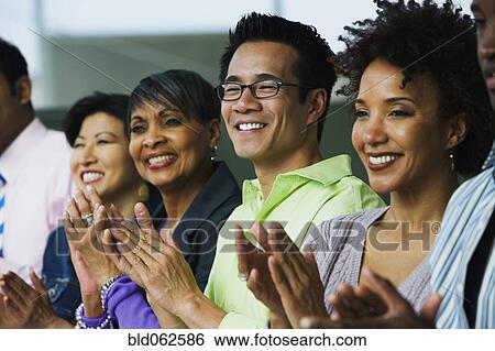 Multi-ethnic business people clapping View Large Photo Image Stock Photograph - Multi-ethnic business people clapping. Fotosearch