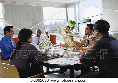 Stock Image - Multi-ethnic business people holding money paper airplanes. Fotosearch - Search Stock Photography, Poster Photos, Pictures, and Photo Clip Art