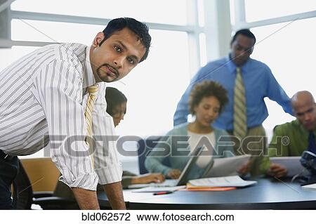 Multi-ethnic business people in meeting View Large Photo Image Stock Image - Multi-ethnic business people in meeting. Fotosearch
