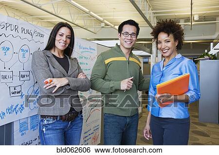 Stock Photograph - Multi-ethnic business people in office. Fotosearch