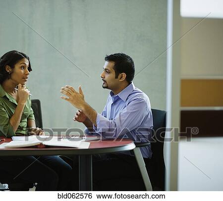 Multi-ethnic business people meeting in office View Large Photo Image Stock Photograph - Multi-ethnic business people meeting in office. Fotosearch