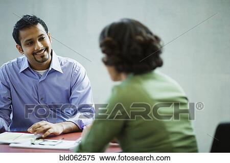Multi-ethnic business people meeting in office View Large Photo Image Stock Photography - Multi-ethnic business people meeting in office. Fotosearch