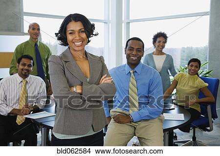 Multi-ethnic business people posing in office View Large Photo Image Picture - Multi-ethnic business people posing in office. Fotosearch
