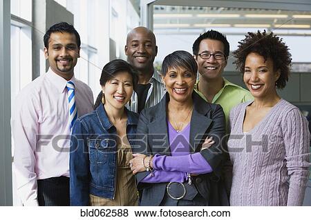 Stock Photo - Multi-ethnic business people posing in office. Fotosearch