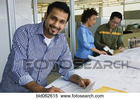 Multi-ethnic business people working in office View Large Photo Image Stock Photography - Multi-ethnic business people working in office. Fotosearch