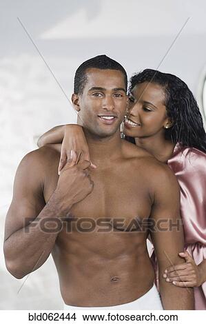 Multi-ethnic couple hugging View Large Photo Image Picture - Multi-ethnic couple hugging. Fotosearch