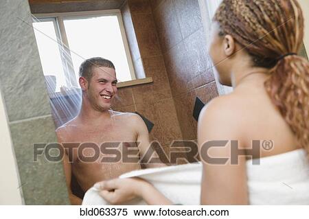 Stock Photography - Multi-ethnic couple showering. Fotosearch