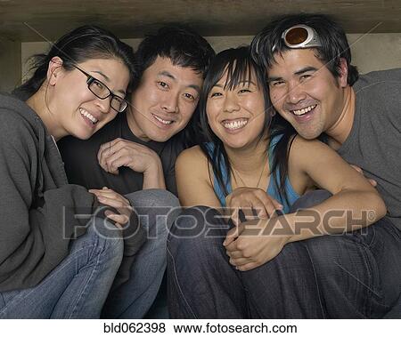 Stock Photo - Multi-ethnic friends smiling. Fotosearch
